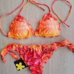 COSTUME DONNA EFFEK TRIANGOLO SBAMBOLATO E SLIP CON FIOCCHI ESTATE 2025 BELLISSIMA FANTASIA NEI COLORO DELL'ARANCIO E DEL ROSSO