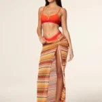 GONNA DONNA EFFEK LUNA CON SPACCO TESSUTO TRAFORATO DAI COLORI CALDI. STAGIONE ESTATE 2025