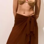 PAREO LUNGO IN TULLE MATINEE DELLA STAGIONE ESTATE 2025. COLORE MARRONE