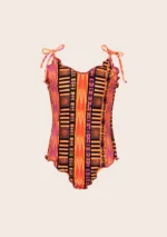 COSTUME BIMBA EFFEK DELLA STAGIONE ESTATE 2025. INTERO SBAMBOLATO NELLA FANTASIA TRIBALE ARANCIO