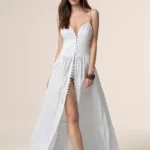 ABITO LUNGO DONNA ME FUI DELLA STAGIONE ESTATE 2025. IN 100% COTONE CON SPACCO E BOTTONCINO SUL DAVANTI, COPPA A TRIANGOLO E BRETELLINA REGOLABILE