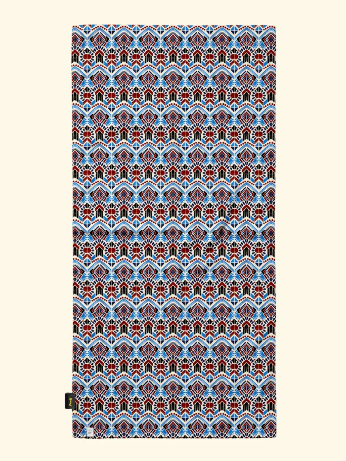 TELO MARE EFFEK IN MICROFIBRA DELLA COLLEZIONE ESTATE 2026. FANTASIA TURCHESE E COCCIO SU BASE PANNA