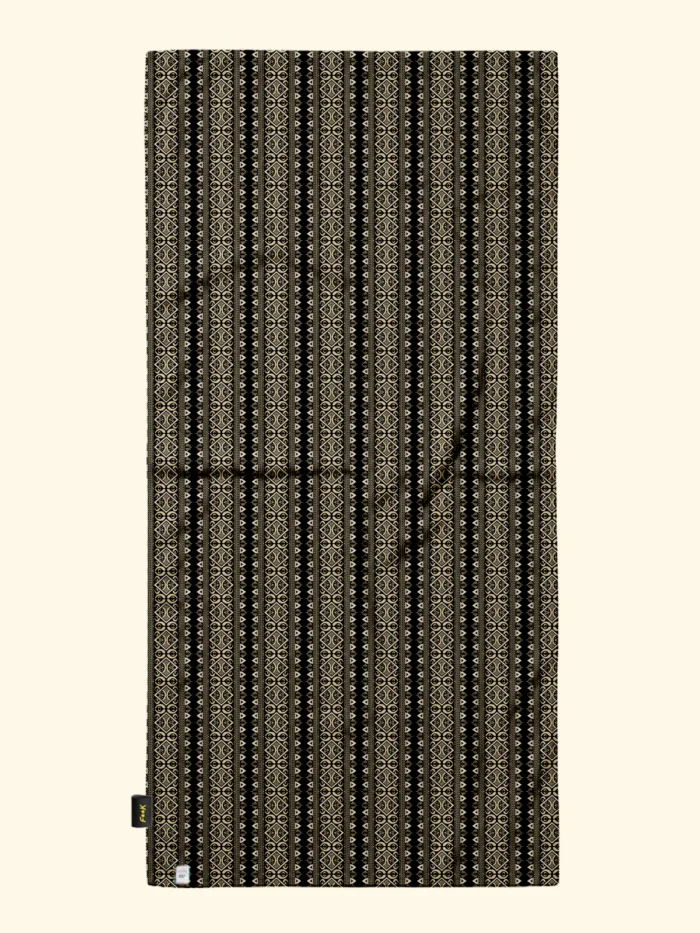 TELO MARE EFFEK IN MICROFIBRA DELLA COLLEZIONE ESTATE 2026. FANTASIA TRIBALE PANNA SU BASE NERA