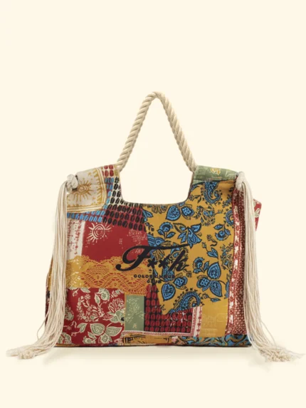 BORSA MARE EFFEK IN TELA DELLA STAGIONE ESTATE 2026. MANICI IN CORDA CON FRANGE LATERALI. BASE PANNA CON FANTASIA TURCHESE, SENAPE E COCCIO