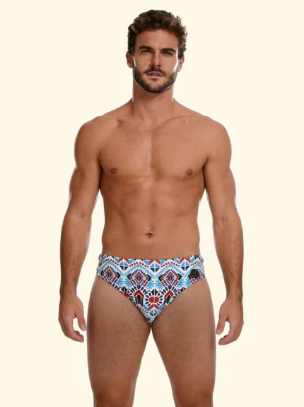 COSTUME UOMO EFFEK DELLA STAGIONE ESTATE 2026. SLIP A FANTASIA ETNICA TURCHESE E COCCIO CON BASE PANNA