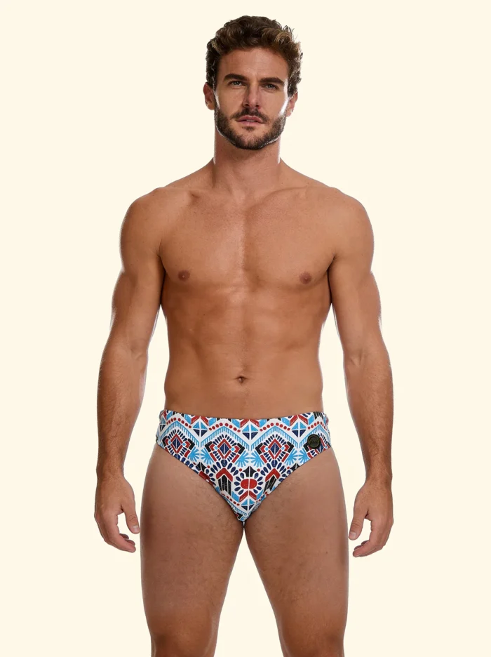 COSTUME UOMO EFFEK DELLA STAGIONE ESTATE 2026. SLIP A FANTASIA ETNICA TURCHESE E COCCIO CON BASE PANNA