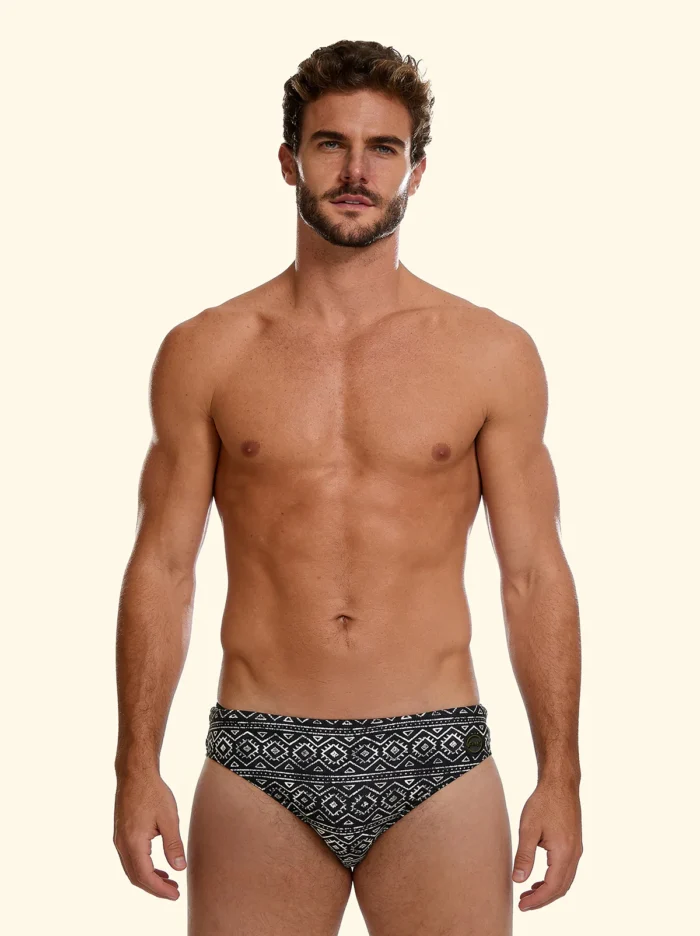 COSTUME UOMO EFFEK DELLA STAGIONE ESTATE 2026. SLIP A FANTASIA TRIBALE BEIGE SU BASE NERA