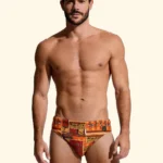 COSTUME UOMO EFFEK DELLA STAGIONE ESTATE 2026. SLIP A FANTASIA AZTECA NEI COLORI ARANCIO E COCCIO