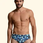 COSTUME UOMO EFFEK DELLA STAGIONE ESTATE 2026. SLIP A FANTASIA CONCHIGLIE E STELLE MARINE CON BASE BLU