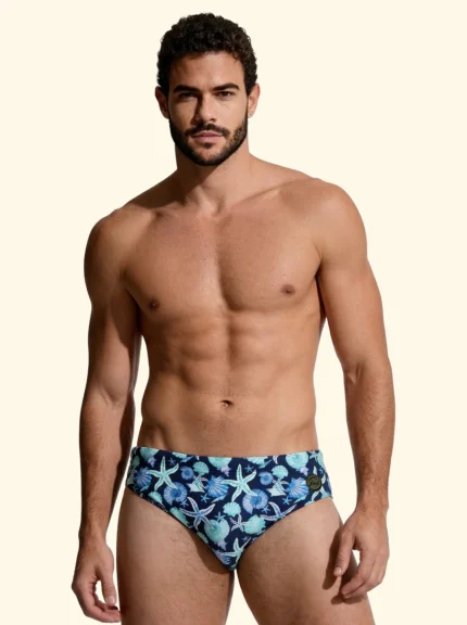COSTUME UOMO EFFEK DELLA STAGIONE ESTATE 2026. SLIP A FANTASIA CONCHIGLIE E STELLE MARINE CON BASE BLU