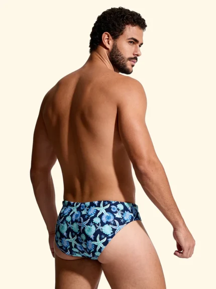 COSTUME UOMO EFFEK DELLA STAGIONE ESTATE 2026. SLIP A FANTASIA CONCHIGLIE E STELLE MARINE CON BASE BLU